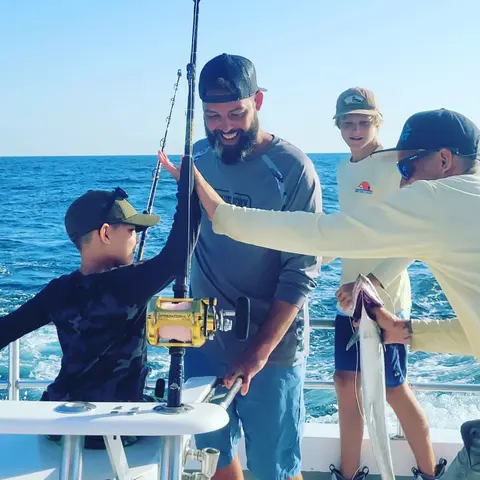 Friends celebrating together on a party boat charter in St. Augustine, FL